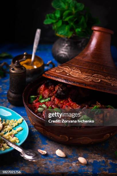 tajin with lamb and dried fruits - lamb stew stock pictures, royalty-free photos & images