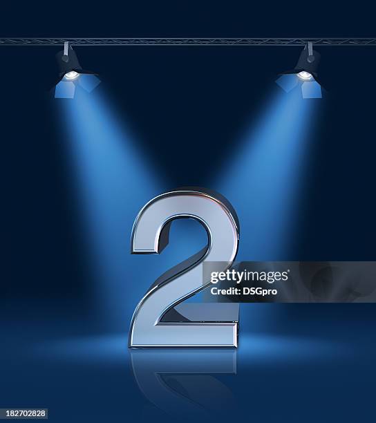 the number 2 depicted on a stage with bright blue lights - seconde place stock pictures, royalty-free photos & images