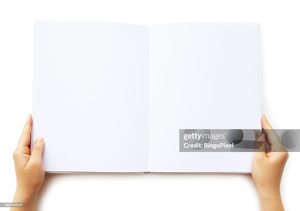 A person holding a blank book of paper 