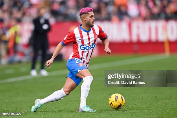 Yan Couto of Girona FC runs with the ball during the LaLiga EA Sports match between Girona FC and Valencia CF at Montilivi Stadium on December 02,...