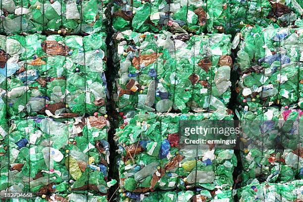 green plastic bottles ready for recycling - recycling stockfoto's en -beelden