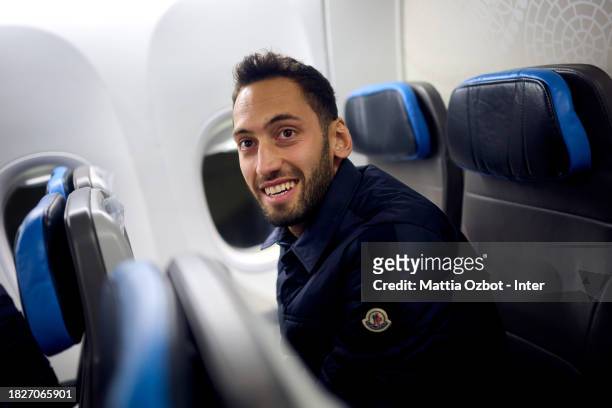 Hakan Calhanoglu of FC Internazionale reacts on the plane during the Inter travel to Naples at Malpensa Airport on December 02, 2023 in Milan, Italy.