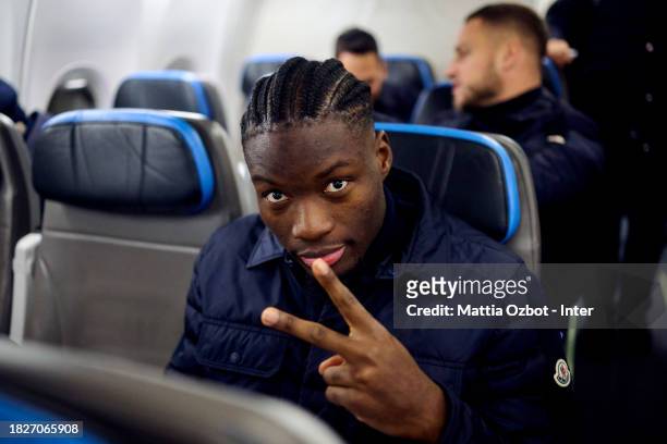 Lucien Agoume of FC Internazionale reacts on the plane during the Inter travel to Naples at Malpensa Airport on December 02, 2023 in Milan, Italy.