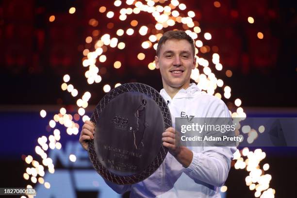 Hamad Medjedovic of Serbia poses for a photo with the Next Gen ATP Finals Trophy after winning the final against Arthur Fils of France during day...