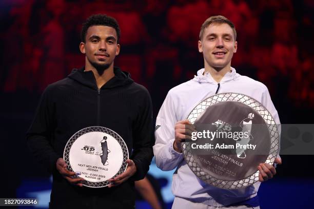 Arthur Fils of France holds the Next Gen ATP Finals Runner Up Trophy with Hamad Medjedovic of Serbia as he holds the Next Gen ATP Finals Trophy after...