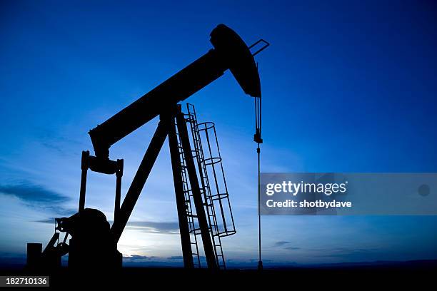 pumpjack on blue - removing stock pictures, royalty-free photos & images