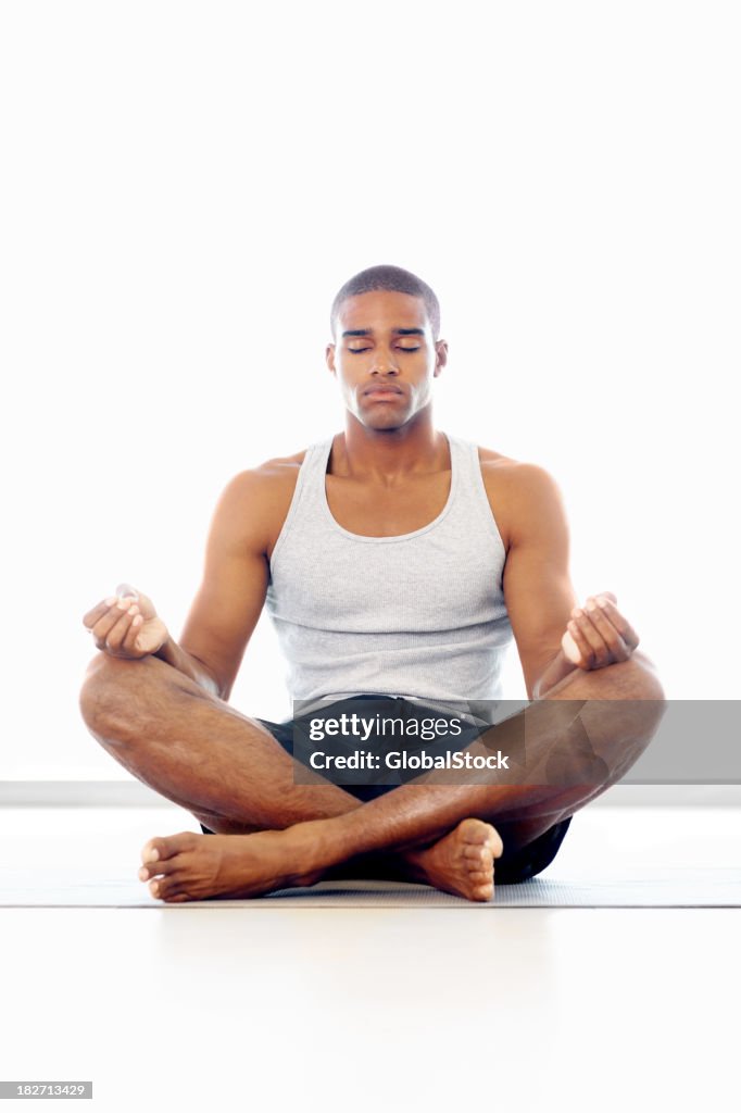 A man meditating in lotus position