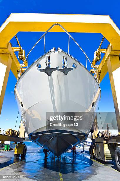 seasonal mending - shipbuilders stock pictures, royalty-free photos & images