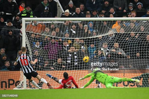 Anthony Gordon of Newcastle United scores the team's first goal during the Premier League match between Newcastle United and Manchester United at St....