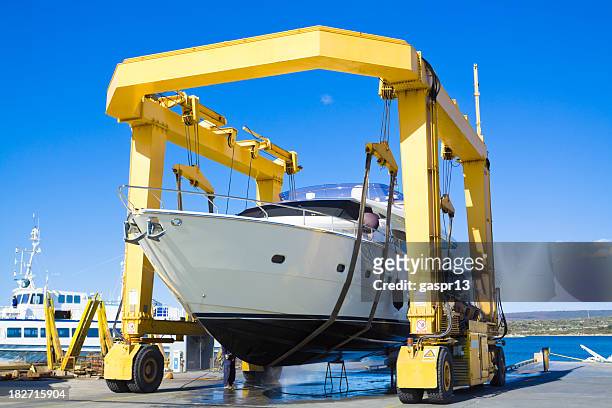 seasonal mending - shipyard crane stock pictures, royalty-free photos & images