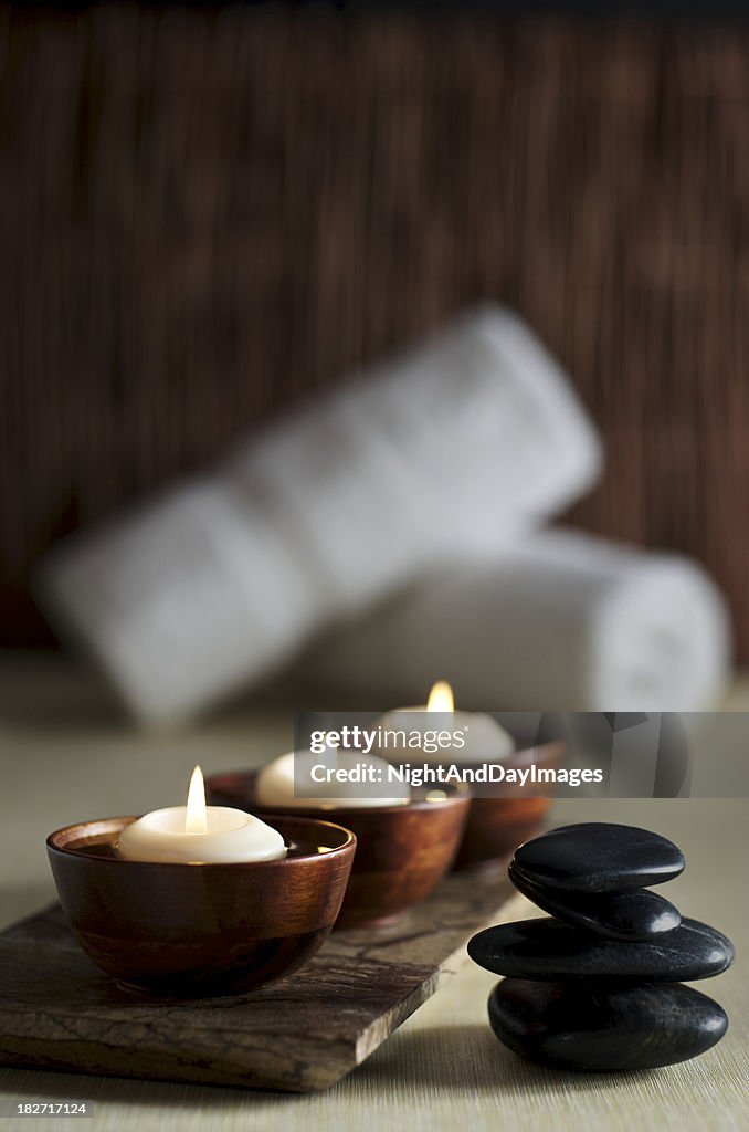 Candles and Massage Stones in a Zen Spa Background