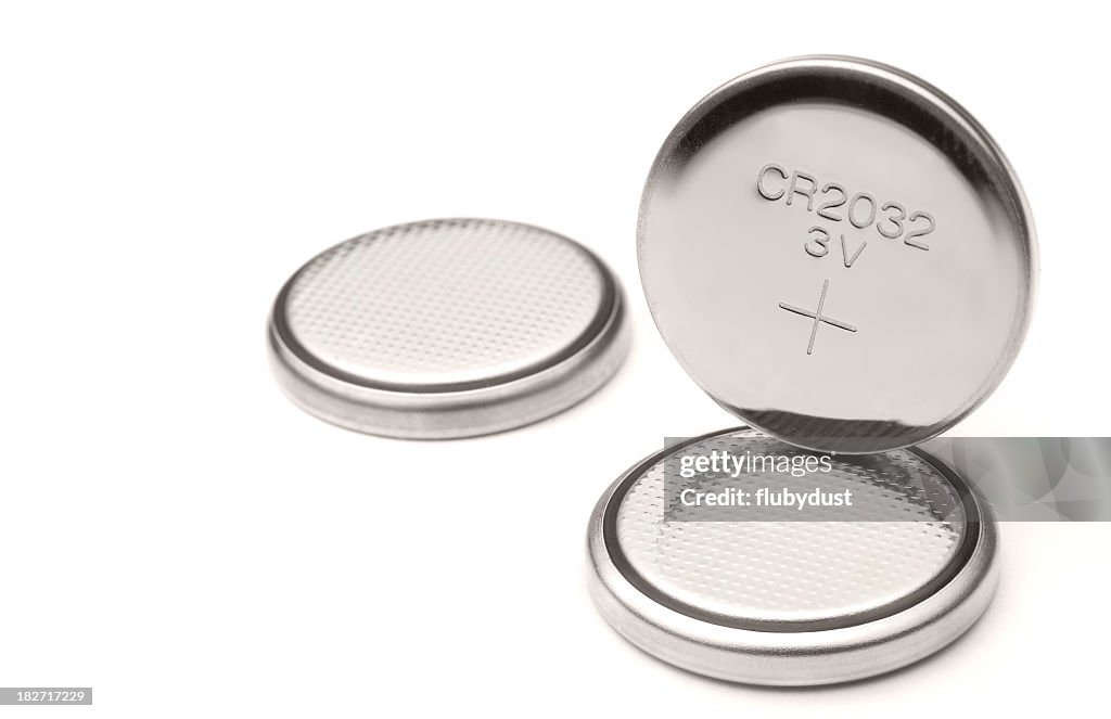 Three lithium battery cells on white background