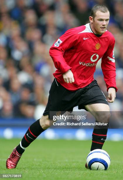 August 13: Wayne Rooney of Manchester United on the ball during the Premier League match between Everton and Manchester United at the Goodison Park...