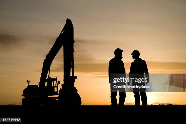 construction workers and equipment - construction meeting helmet stock pictures, royalty-free photos & images