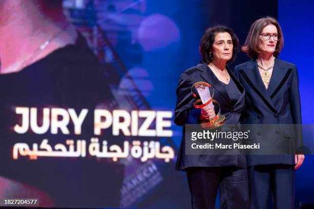Joanna Hogg and actress Hiam Abbass, winner of the Jury Prize for the movie "Bye Bye Tiberias" stand on stage during the closing ceremony during the...
