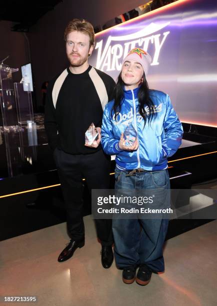 And Billie Eilish accept the Film Song of the Year award during Variety's Hitmakers presented by Sony Audio on December 02, 2023 in Hollywood,...