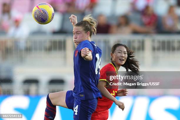 Emily Sonnett of the United States heads the ball during the second half of an international friendly against China PR at DRV PNK Stadium on December...