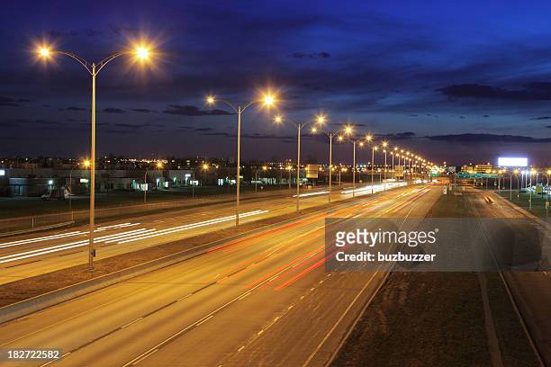 montreal illuminated highway at night - street light stock pictures, royalty-free photos & images