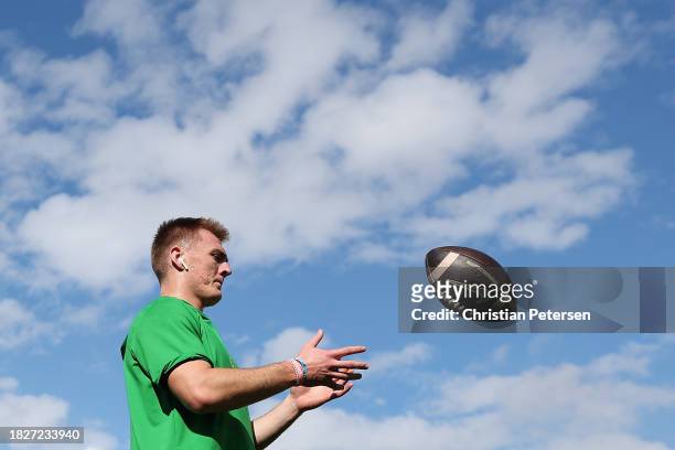 Quarterback Bo Nix of the Oregon Ducks warms up before the NCAAF game against the Arizona State Sun Devils at Mountain America Stadium on November...