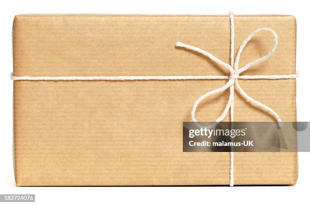 brown wrapped parcel - string stock pictures, royalty-free photos & images