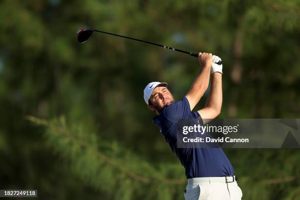 Scottie Scheffler of the United States plays his tee shot on the 13th hole during the third round of the Hero World Challenge at Albany Golf Course...