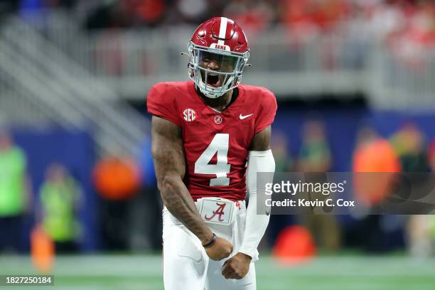 Jalen Milroe of the Alabama Crimson Tide celebrates after passing for a touchdown during the second quarter against the Georgia Bulldogs in the SEC...