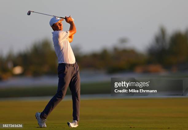 Jordan Spieth of the United States hits his approach shot on the 18th hole during the third round of the Hero World Challenge at Albany Golf Course...