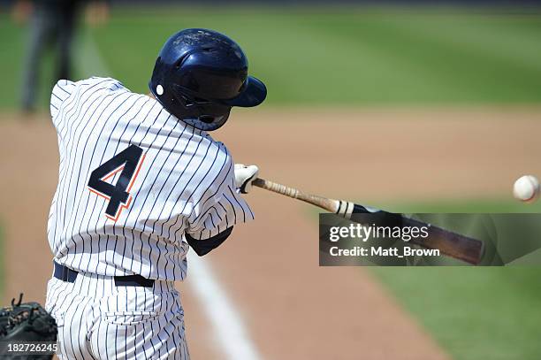 baseball batter - baseball player hitting ball stock pictures, royalty-free photos & images