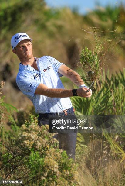 Will Zalatoris of the United States plays his second shot on the 18th hole during the third round of the Hero World Challenge at Albany Golf Course...