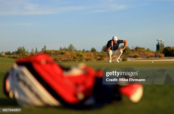 Scottie Scheffler of the United States lines up a putt on the 17th hole during the third round of the Hero World Challenge at Albany Golf Course on...