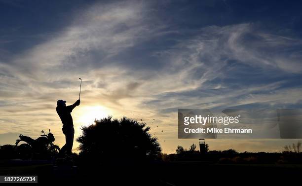 Scottie Scheffler of the United States plays his shot from the 17th tee during the third round of the Hero World Challenge at Albany Golf Course on...