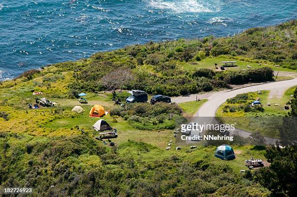 camping along ocean aerial view - big sur stock pictures, royalty-free photos & images