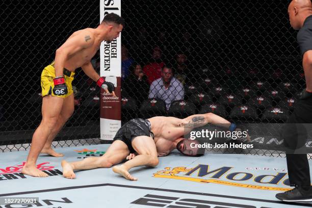 Drakkar Klose knocks out Joe Solecki with a slam in a lightweight fight during the UFC Fight Night event at Moody Center on December 02, 2023 in...