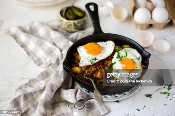 hash with pulled pork on frying pan - fried potato stock pictures, royalty-free photos & images