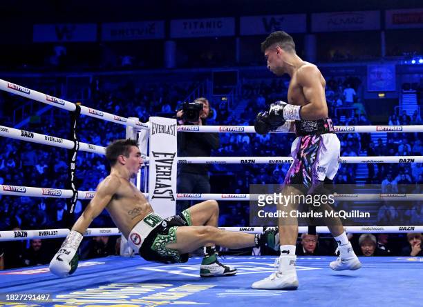 Michael Conlan is knocked down by Jordan Gill during the WBA International Super Featherweight Title fight between Michael Conlan and Jordan Gill at...