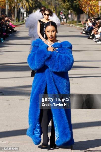 Cardi B walks the runway down South Windsor Boulevard during the Balenciaga Fall 2024 fashion show on December 02, 2023 in Los Angeles, California.