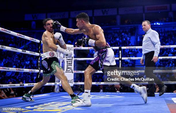 Michael Conlan is punched by Jordan Gill during the WBA International Super Featherweight Title fight between Michael Conlan and Jordan Gill at The...