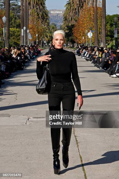 Brigitte Nielsen walks the runway down South Windsor Boulevard during the Balenciaga Fall 2024 fashion show on December 02, 2023 in Los Angeles,...