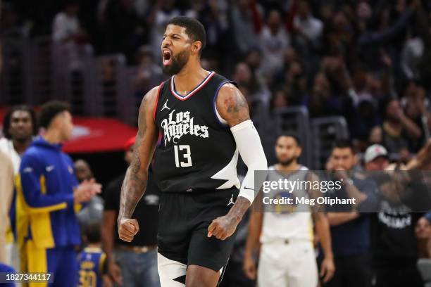 Paul George of the LA Clippers reacts to his shot in the end of the fourth quarter against the Golden State Warriors at Crypto.com Arena on December...