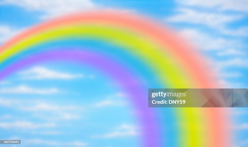 Rainbow against fanciful blue sky