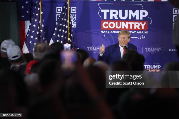 Republican presidential candidate former President Donald Trump speaks a a commit to caucus campaign event at the Whiskey River bar on December 02,...