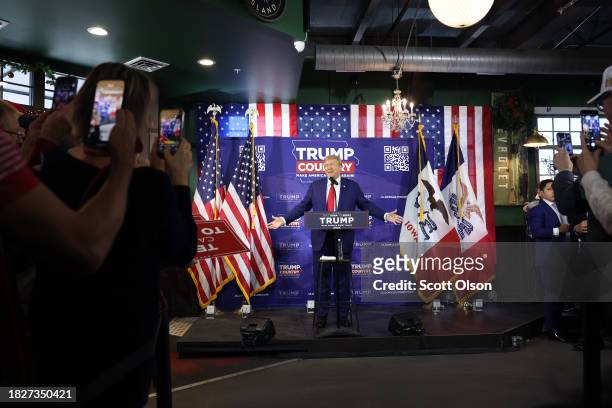 Republican presidential candidate former President Donald Trump speaks at a commit to caucus campaign event at the Whiskey River bar on December 02,...