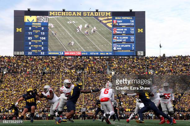 Kyle McCord of the Ohio State Buckeyes runs the ball against the Michigan Wolverines at Michigan Stadium on November 25, 2023 in Ann Arbor, Michigan.