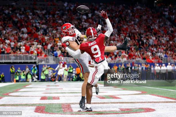 Trey Amos of the Alabama Crimson Tide breaks up a pass intended for Brock Bowers of the Georgia Bulldogs during the third quarter in the SEC...