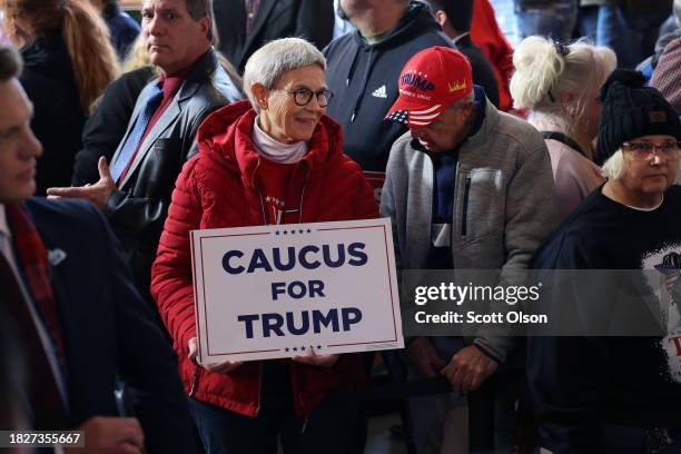 Guests wait for Republican presidential candidate former President Donald Trump to speak at a commit to caucus campaign event at the Whiskey River...