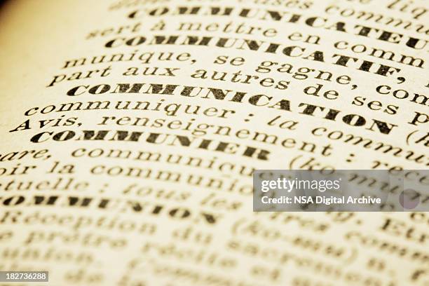 communication | french dictionary macro - french word stock pictures, royalty-free photos & images