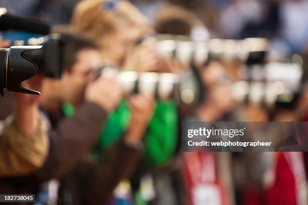 capturing an image - paparazzi photographer stockfoto's en -beelden