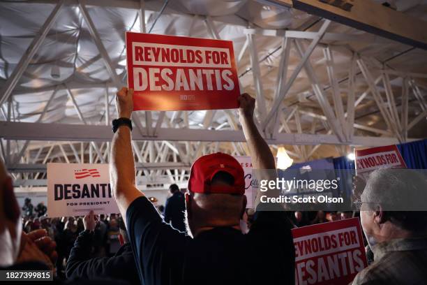Guests cheer as Republican presidential candidate Florida Governor Ron DeSantis speaks during a campaign rally at the Thunderdome on December 02,...