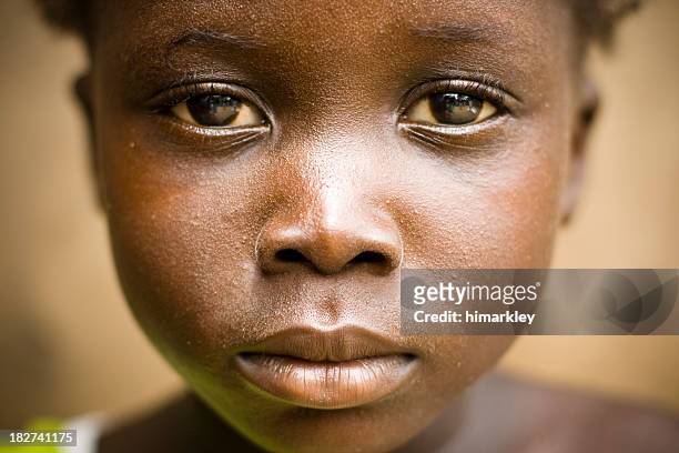 a portrait of an african girl with a sad expression - african culture 個照片及圖片檔
