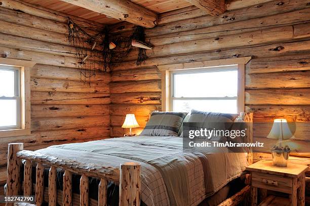 log cabin bedroom - rustic cabin stock pictures, royalty-free photos & images